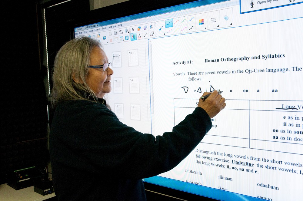 A WDEC Teacher demonstrates Native Languages using a SMART Board